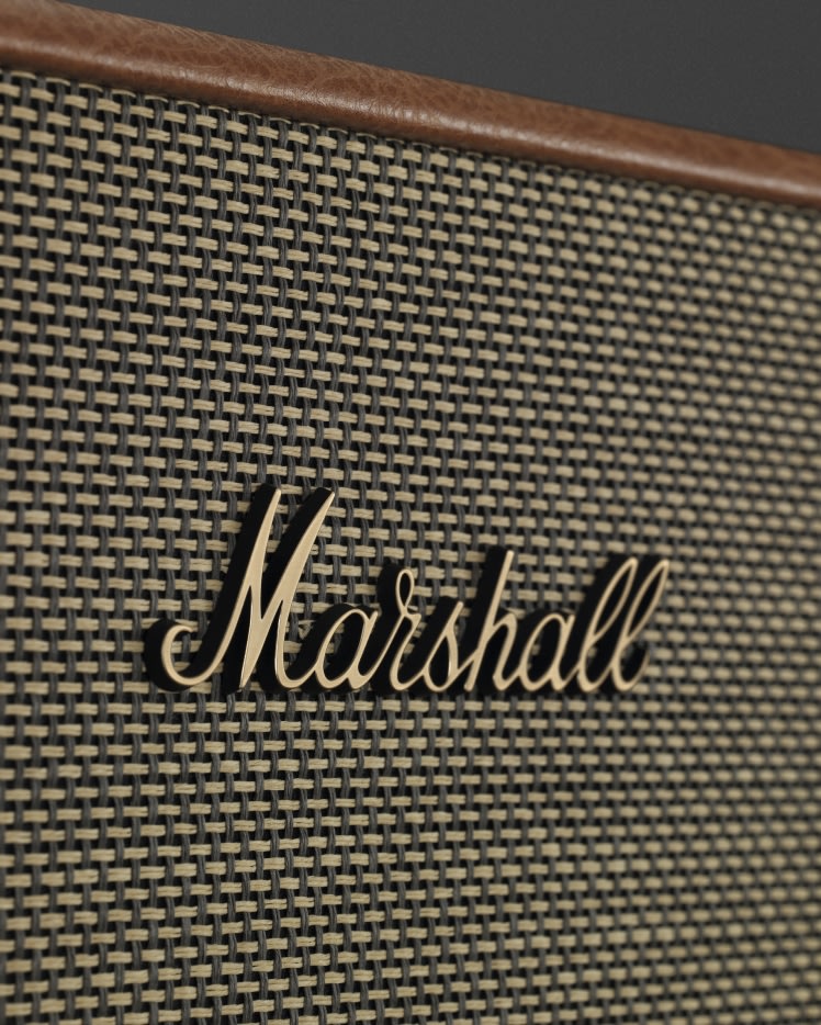A close up of the ACTON III BROWN speaker with the word Marshall on it.