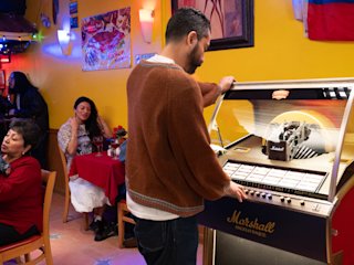 A man selecting a music on the Marshall Jukebox