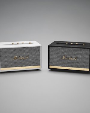 Two Acton II Bluetooth speakers next to each other, one white and one black.