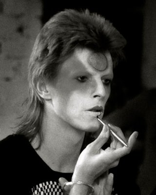 David Bowie, applying makeup to appear as Ziggy Stardust
