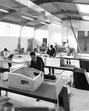A black and white photo of men working in a Marshall's factory.