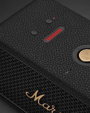 The power and bluetooth button on top of a black Marshall Middleton II speaker.