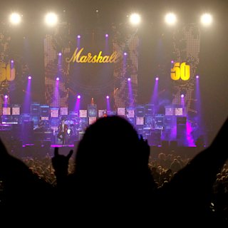 Silouette of a person standing watch the live show