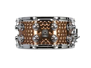 A close up of a hand hammered snare drum by Natal Drums