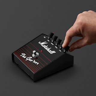 A hand adjusting the sound on the Guv'nor Vintage Reissue Pedal.
