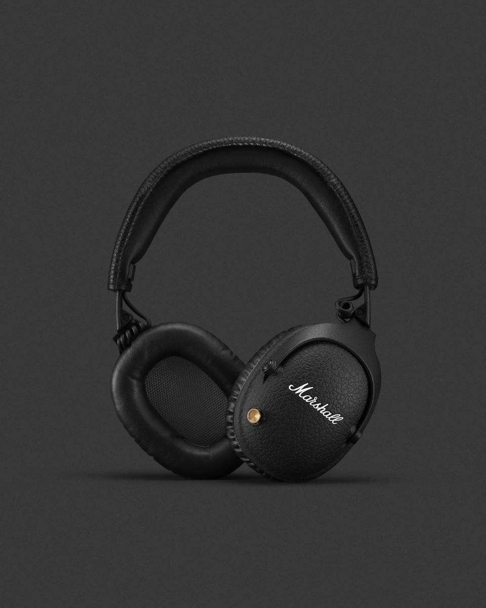 A pair of black headphones from Marshall on a gray background.