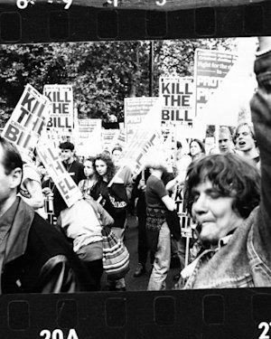 UK protesters march on Whitehall to oppose the Criminal Justice and Public Order Act in 1994.