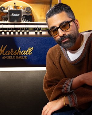 Angelo Baque posing next to the Marshall Jukebox