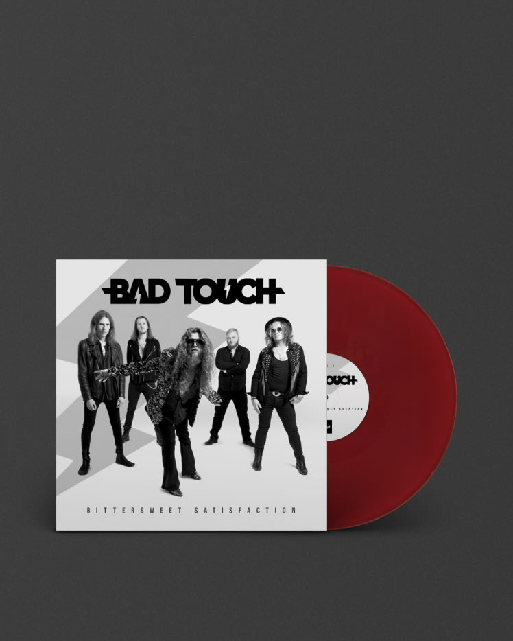 A red Marshall BITTERSWEET SATISFACTION LP with the words BAD TOUCH on it, perfect for music enthusiasts.