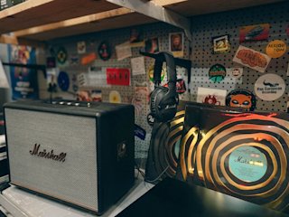 A black Woburn III speaker by Marshall placed in a record store
