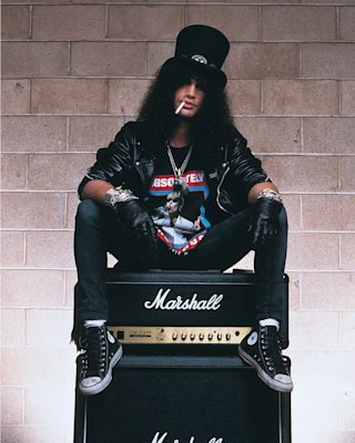 Slash sat on top of his AFD with a cigarette in his mouth