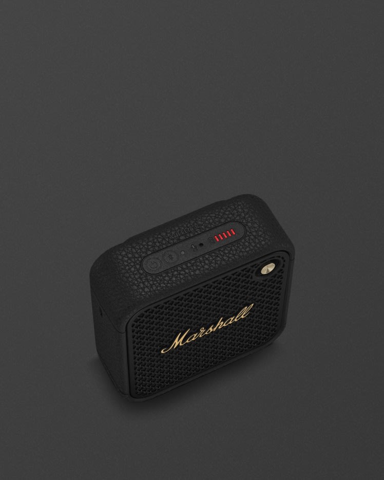 Marshall Willen II Black and Brass portable Bluetooth speaker featuring a control panel with buttons and a red LED power indicator on top.