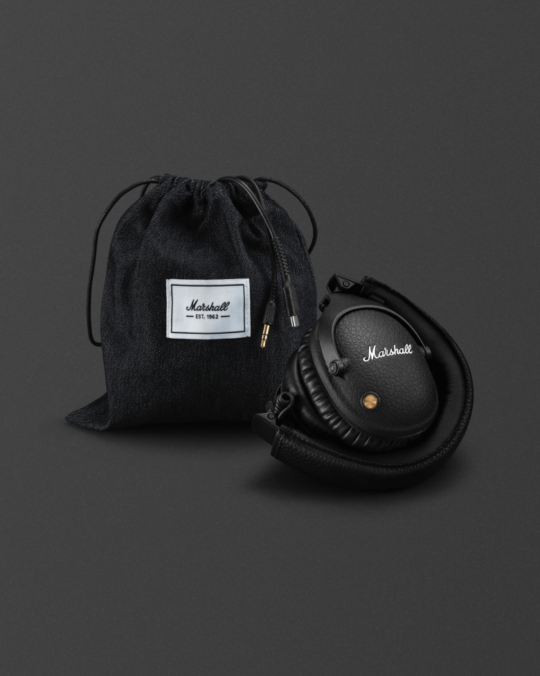 Monitor over-ear headphones next to a Marshall gift pouch.