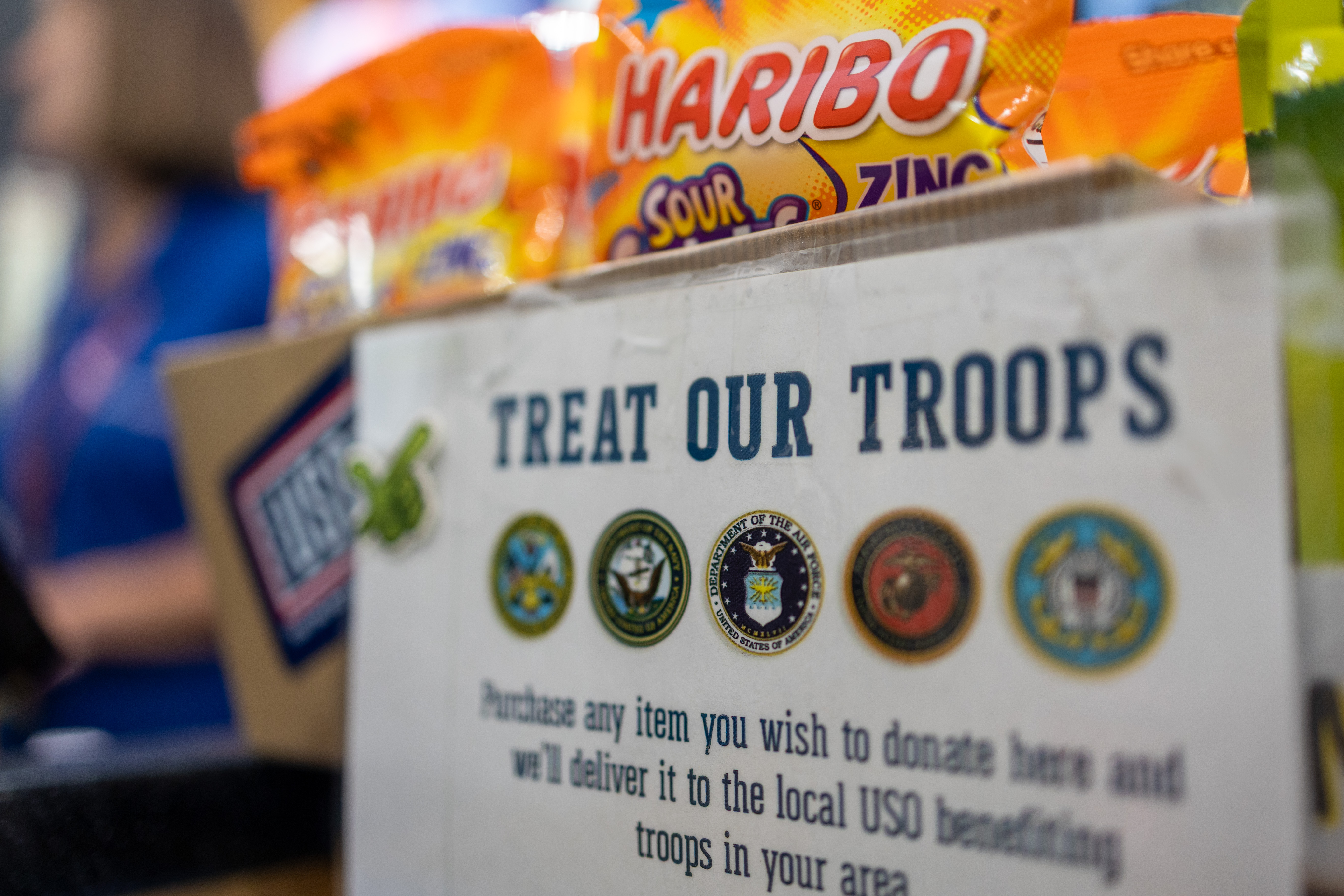 "Treat Our Troops" donation box with Haribo candy packs, supporting USO and military service members.