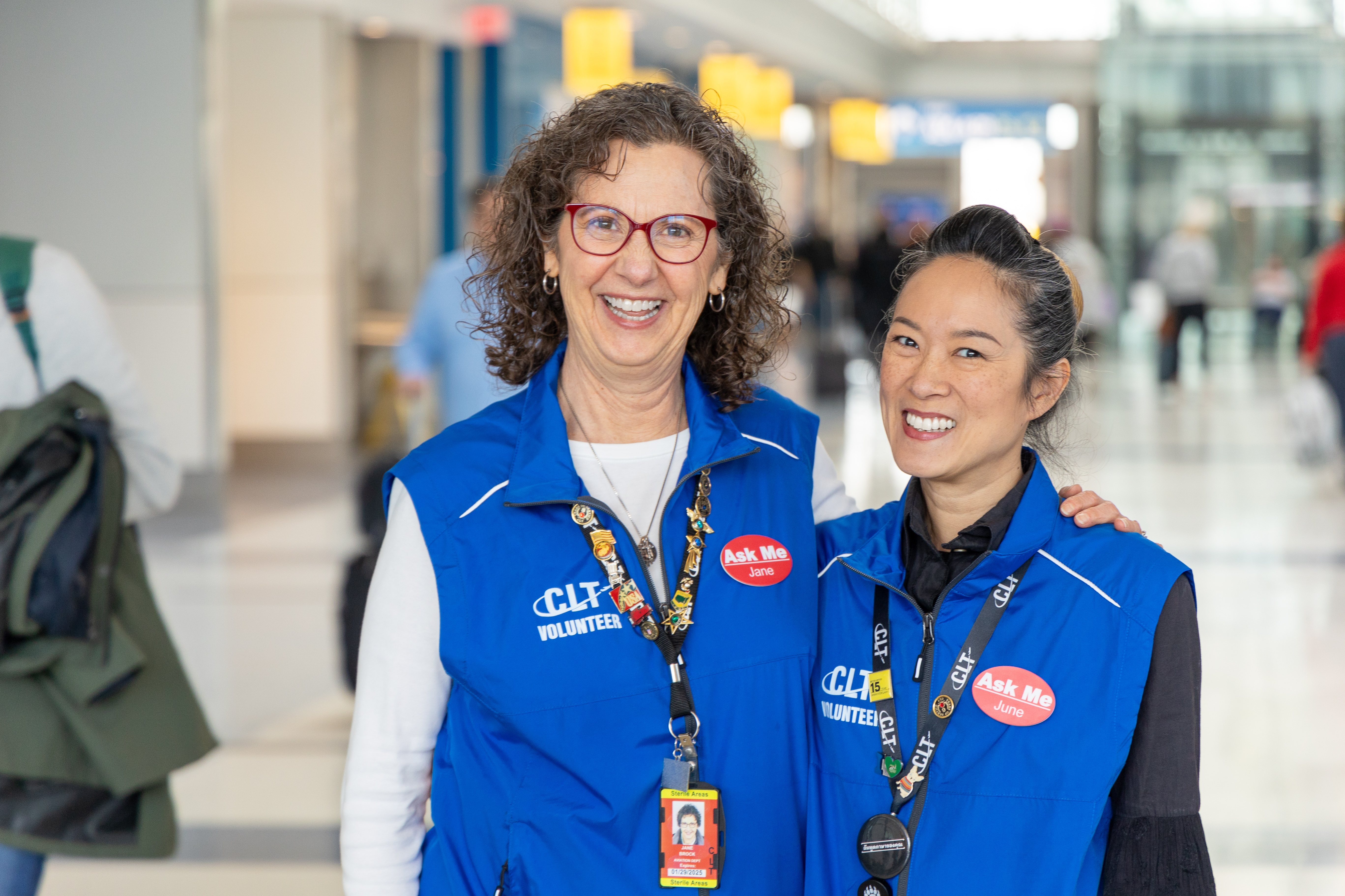 two airport volunteers at airport