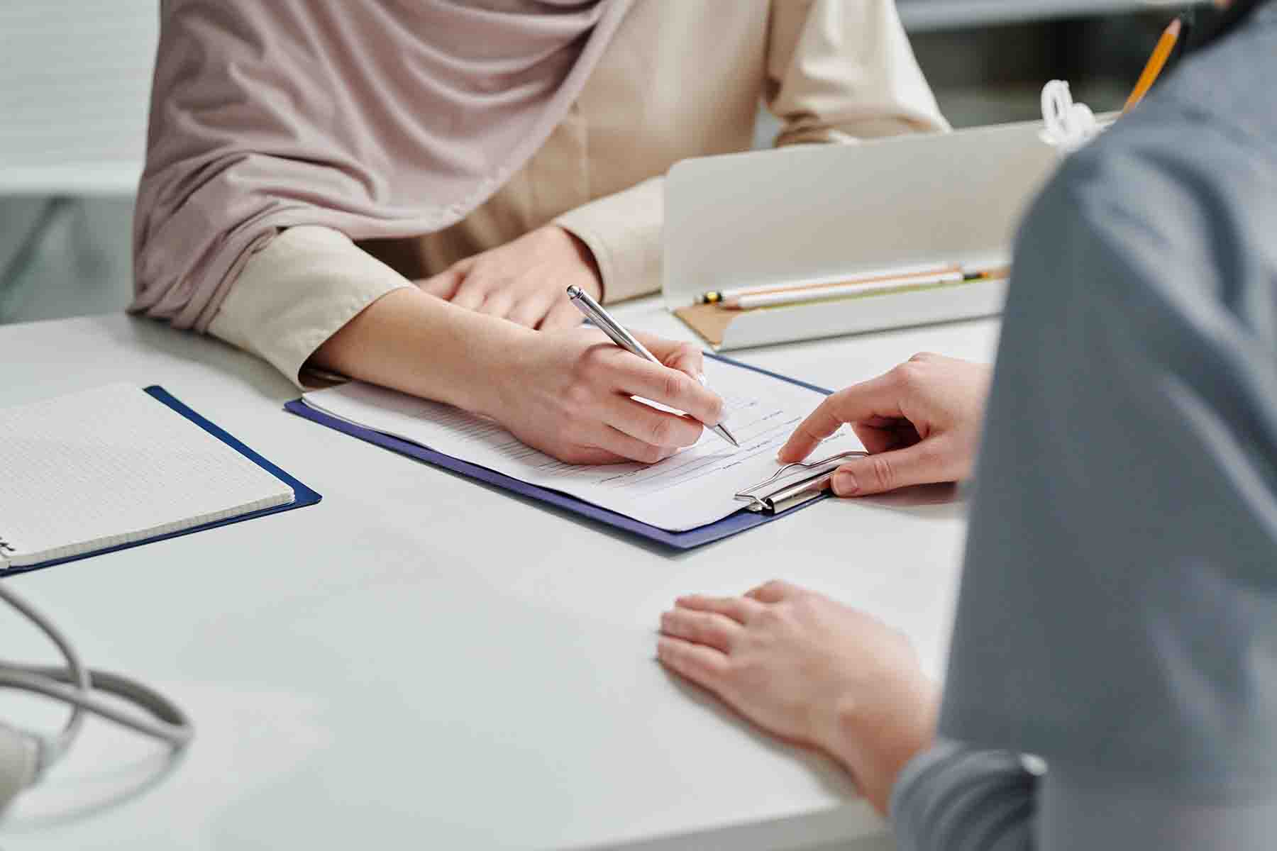 a woman filling out a form