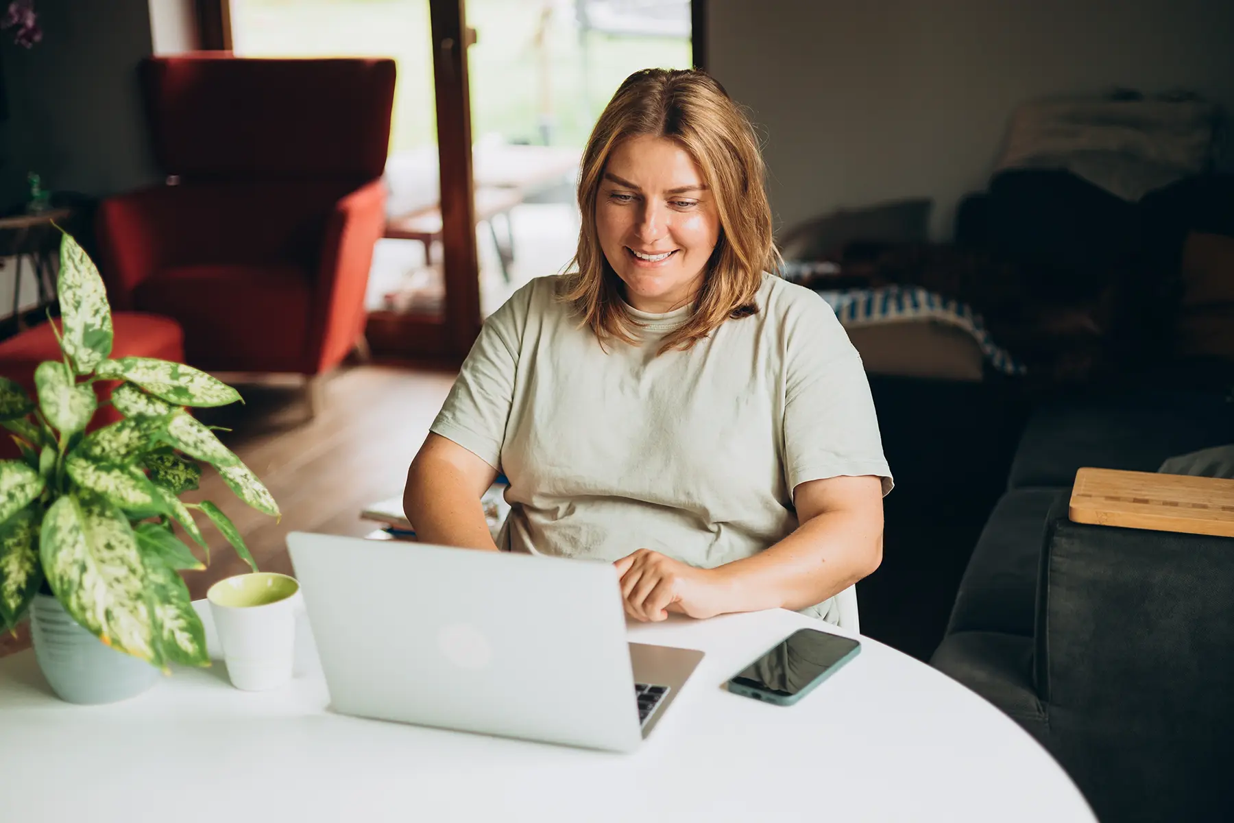 Woman happily looking at her computer