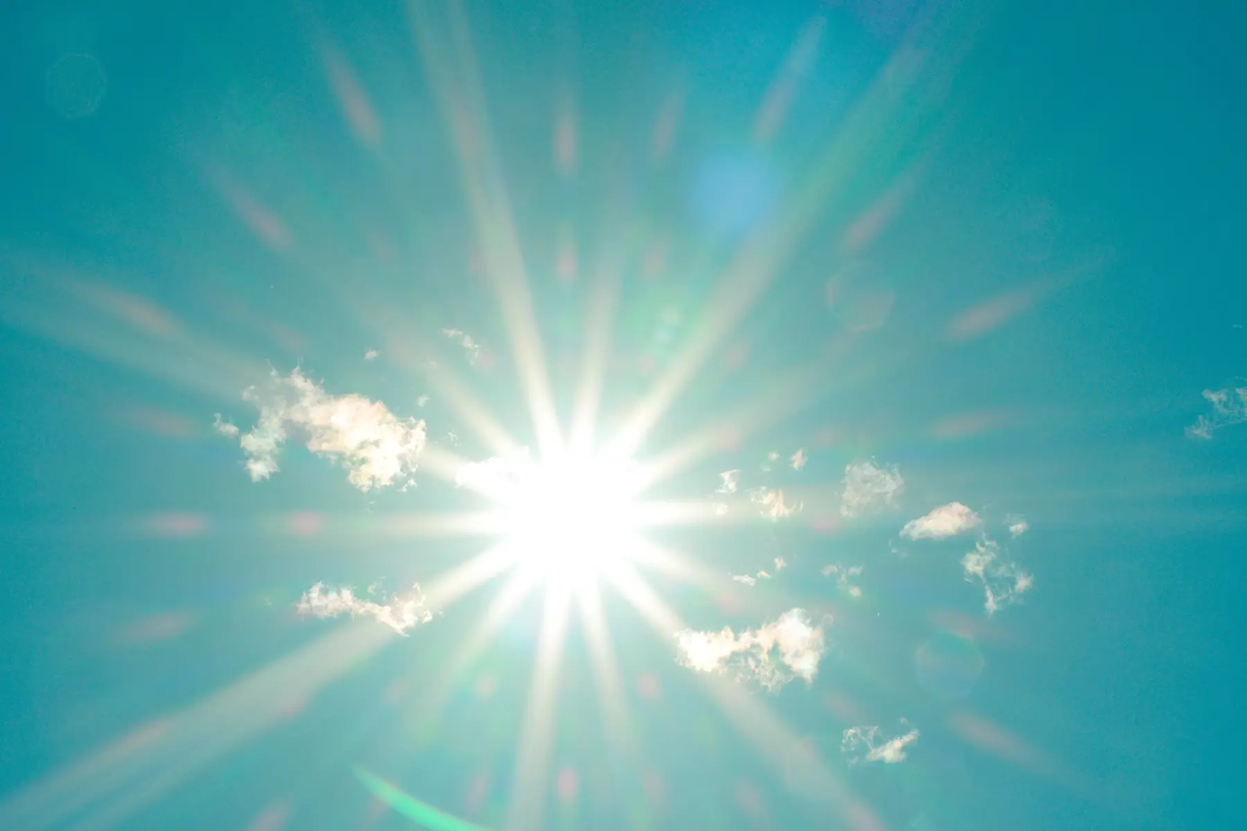 Blue sky, sun shining down