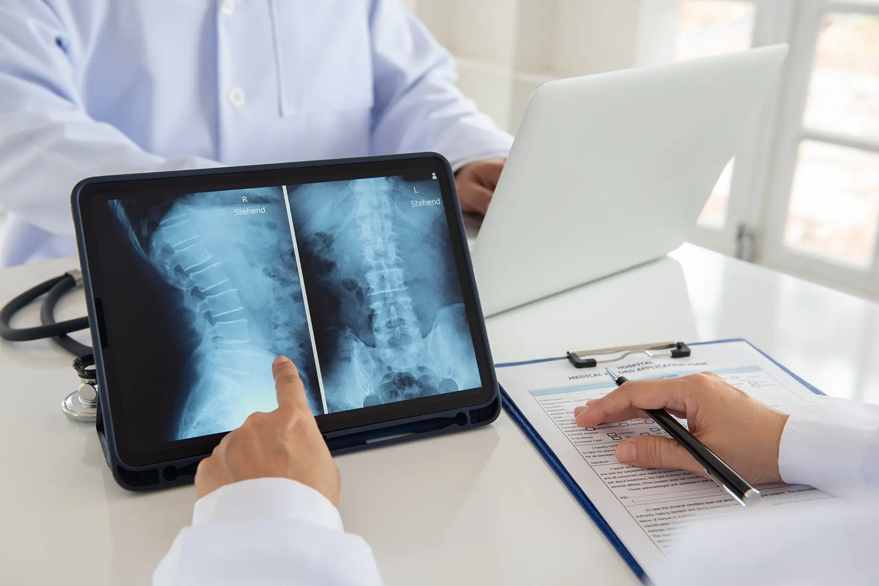 A doctor analyzing x-ray result