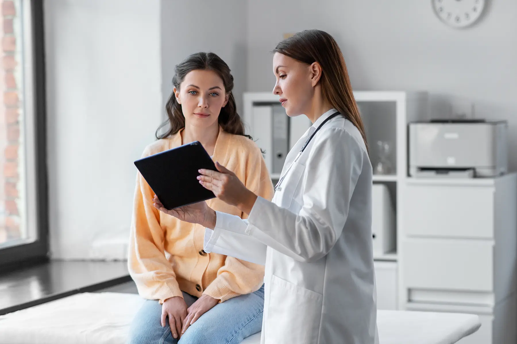 A doctor talking to her patient