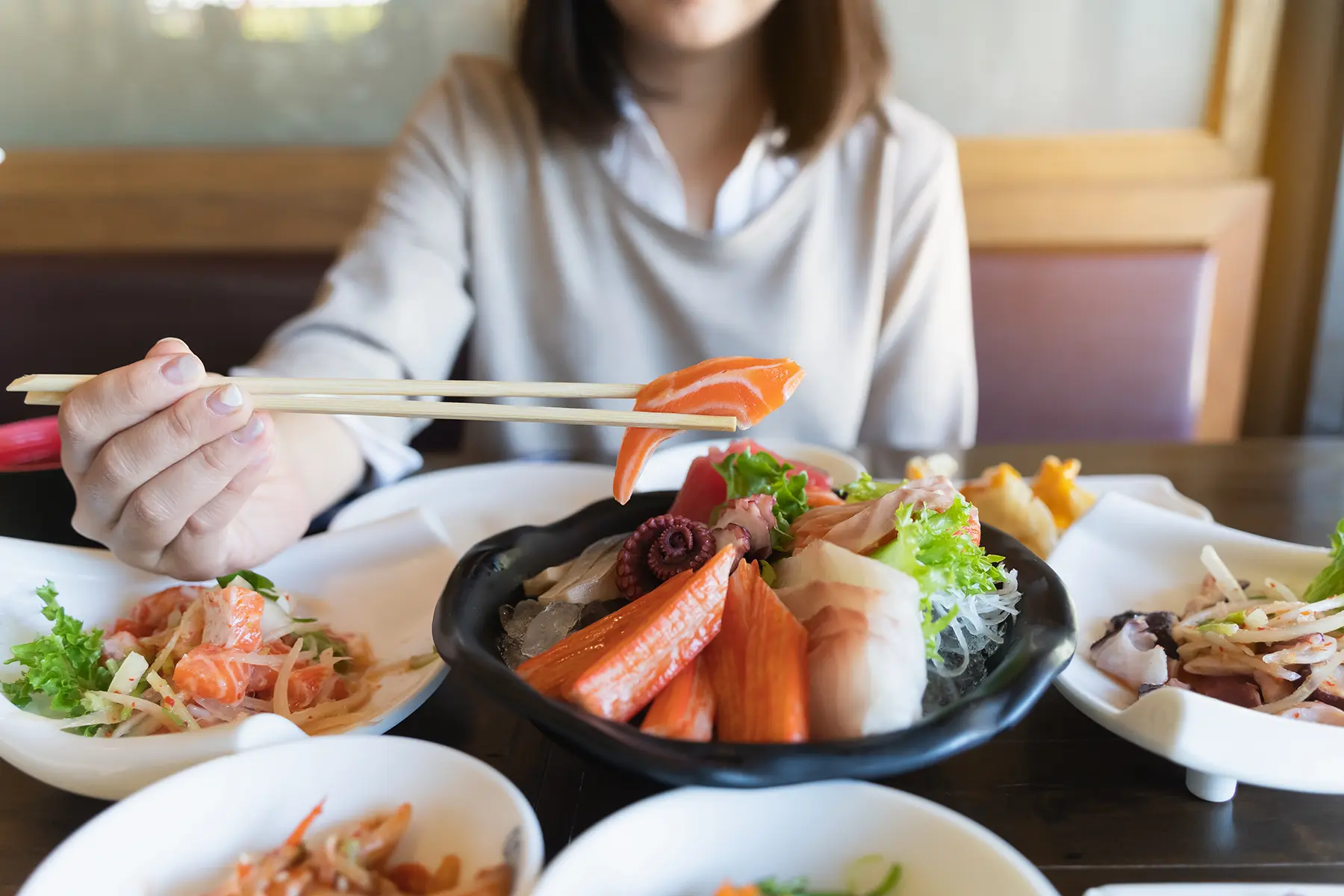 A woman enjoying her seafood lunch