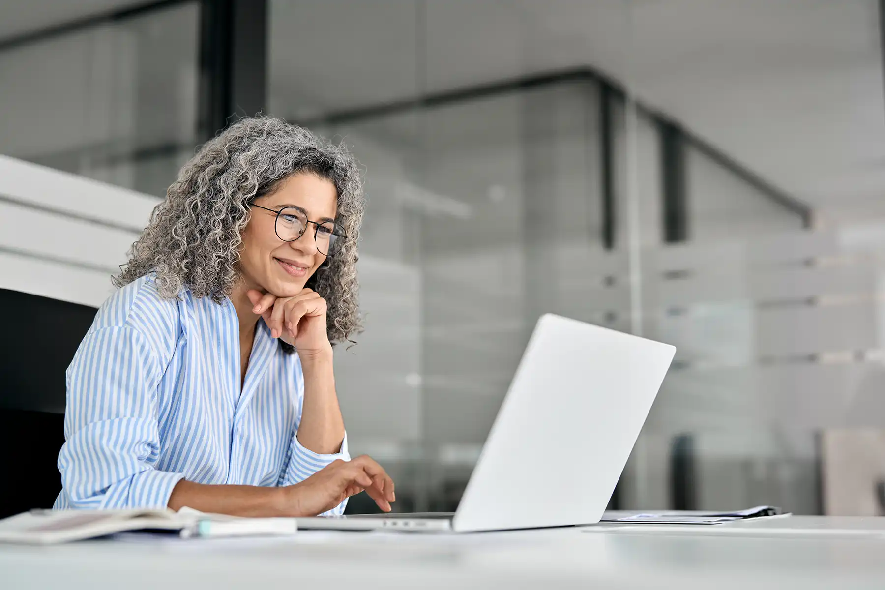 Woman in her 50s on her computer