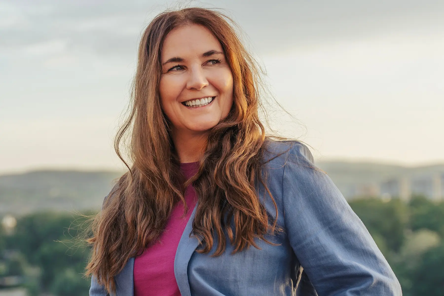Woman in menopause smiling confidently.