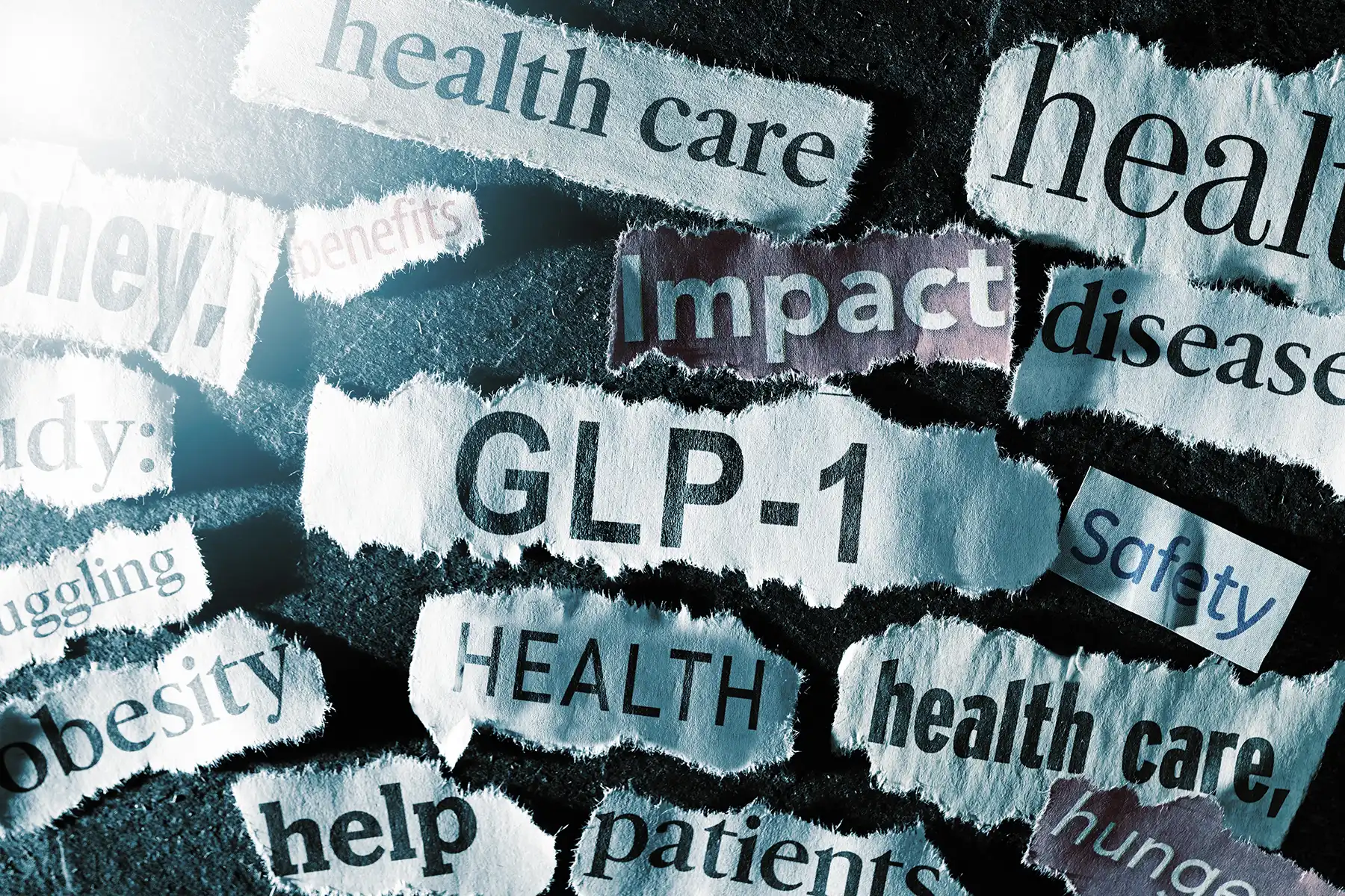 Various pieces of papers with words related to GLP-1 medications