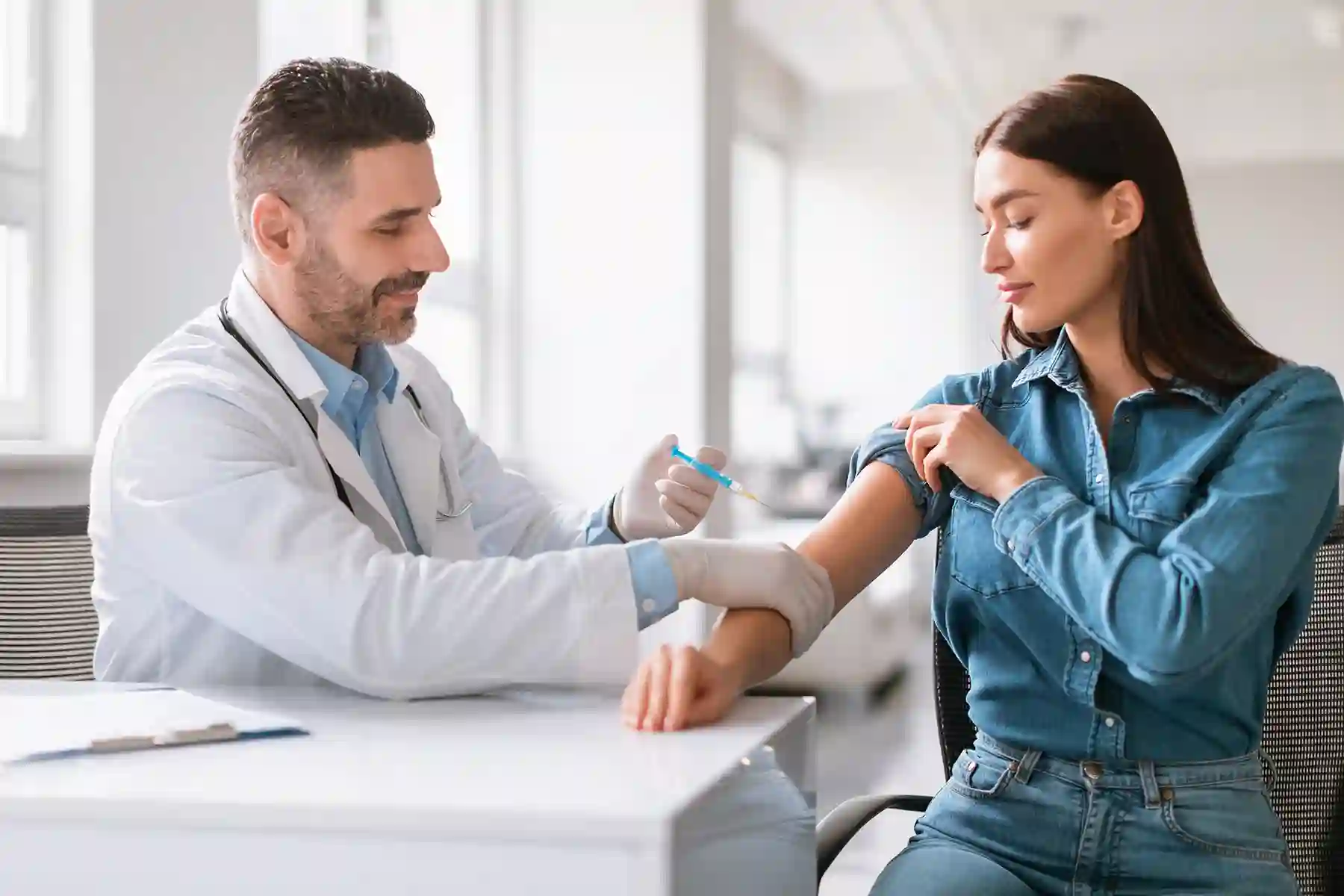 a woman getting a vaccine