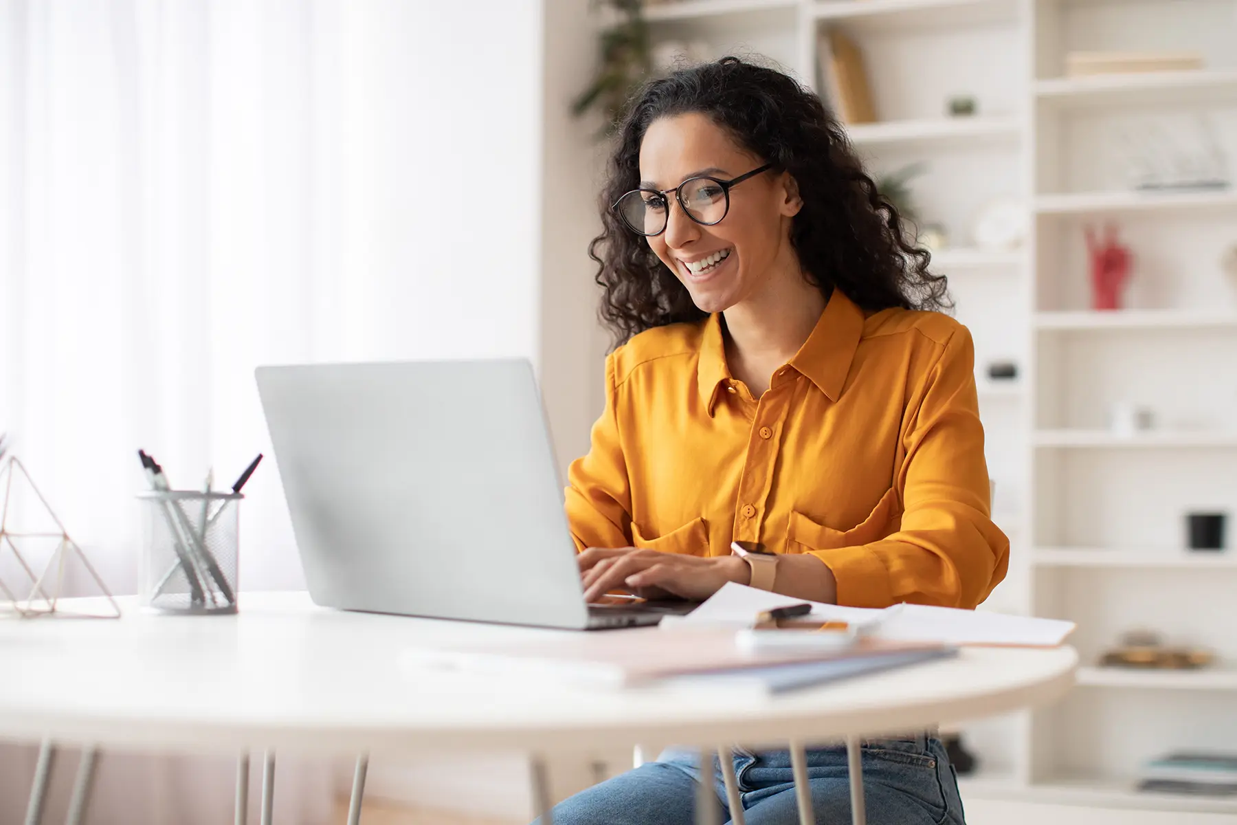 woman on her computer smiling