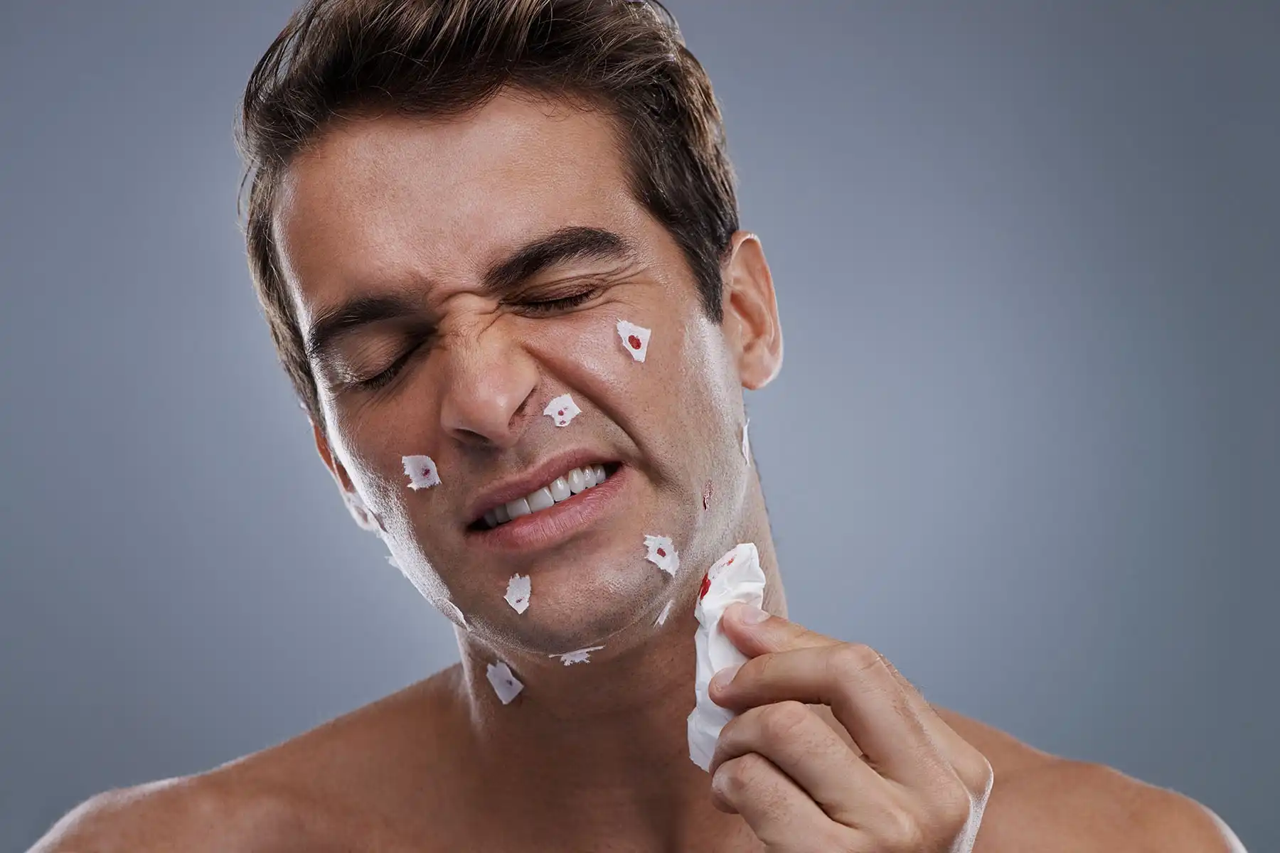 A male in his thirties with razor cuts.