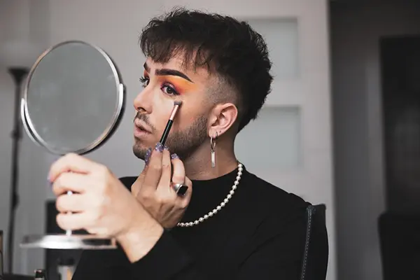 Man applying makeup