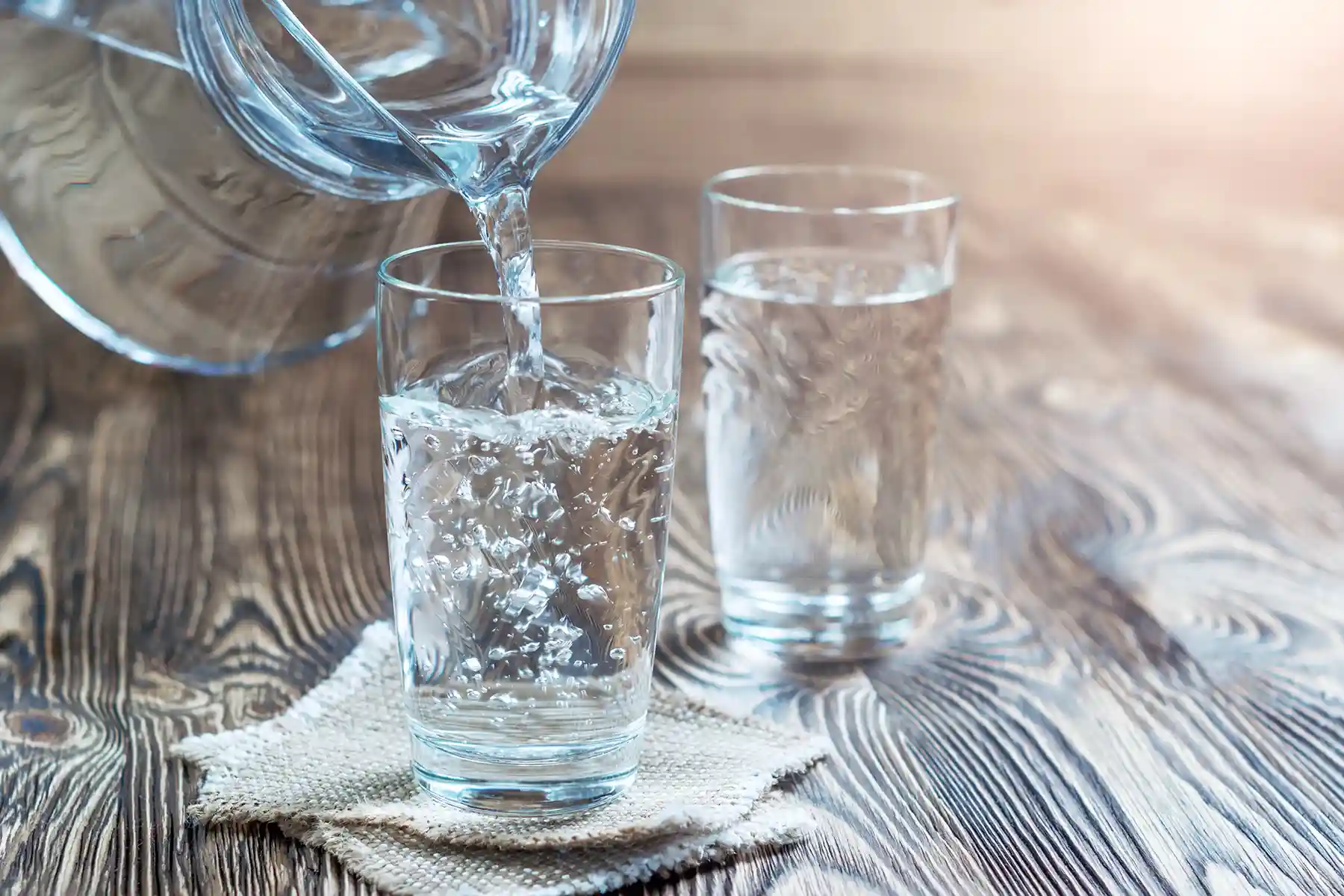 Pouring water into a glass