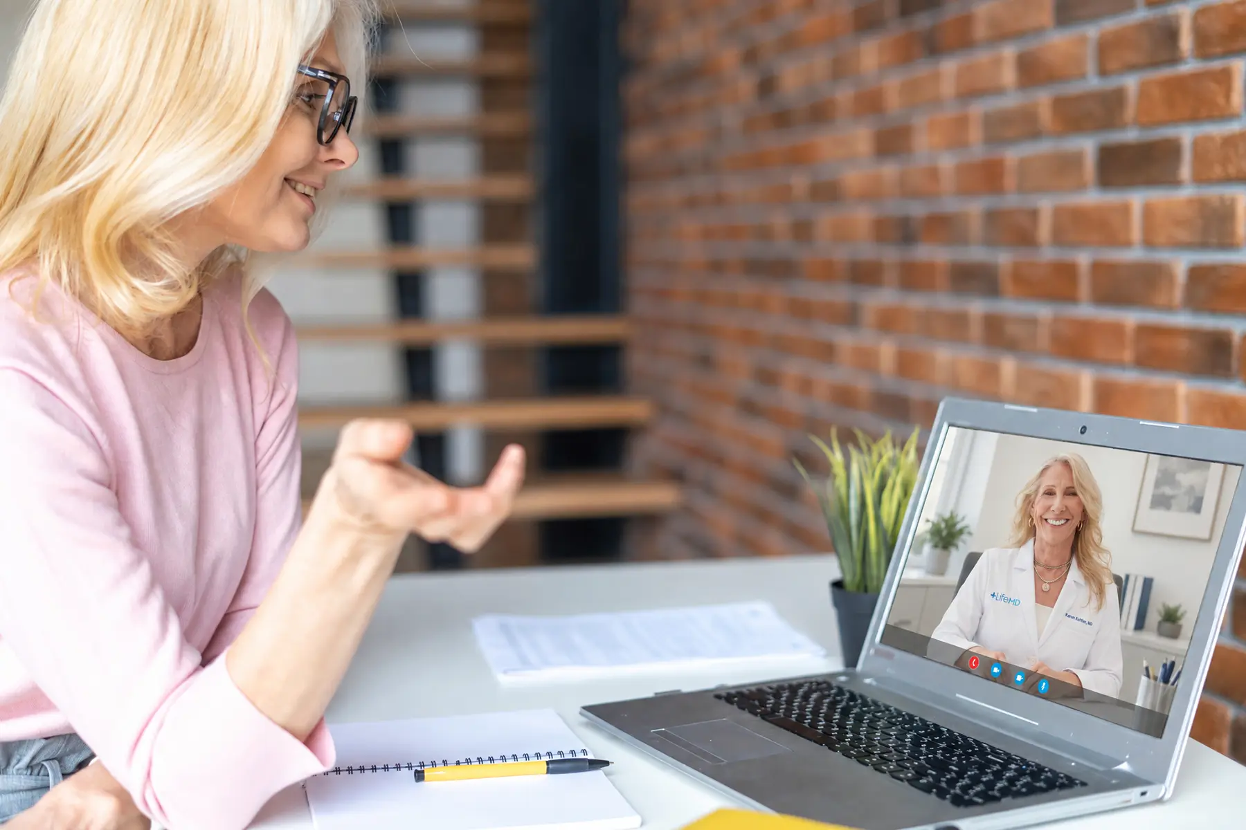 Woman in midlife on a video call with Dr. Koffler