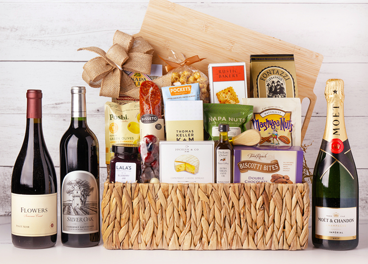 image of a gift basket full of chocolates, sausages, wine and other treats