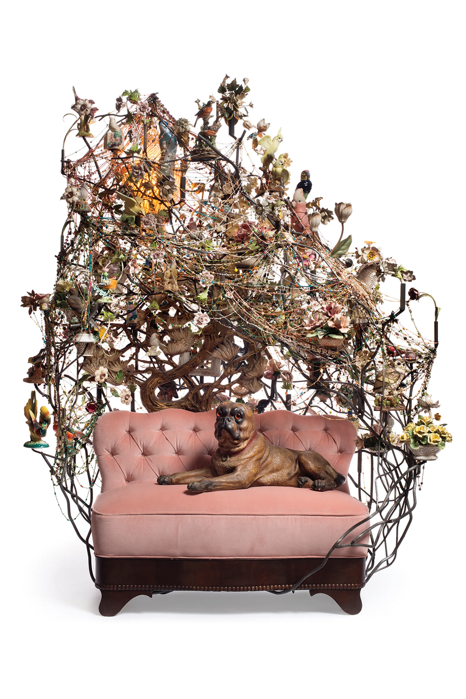 *Rescue*, 2013, mixed media including ceramic birds, metal flowers, ceramic mastiff, vintage settee, and light fixture.