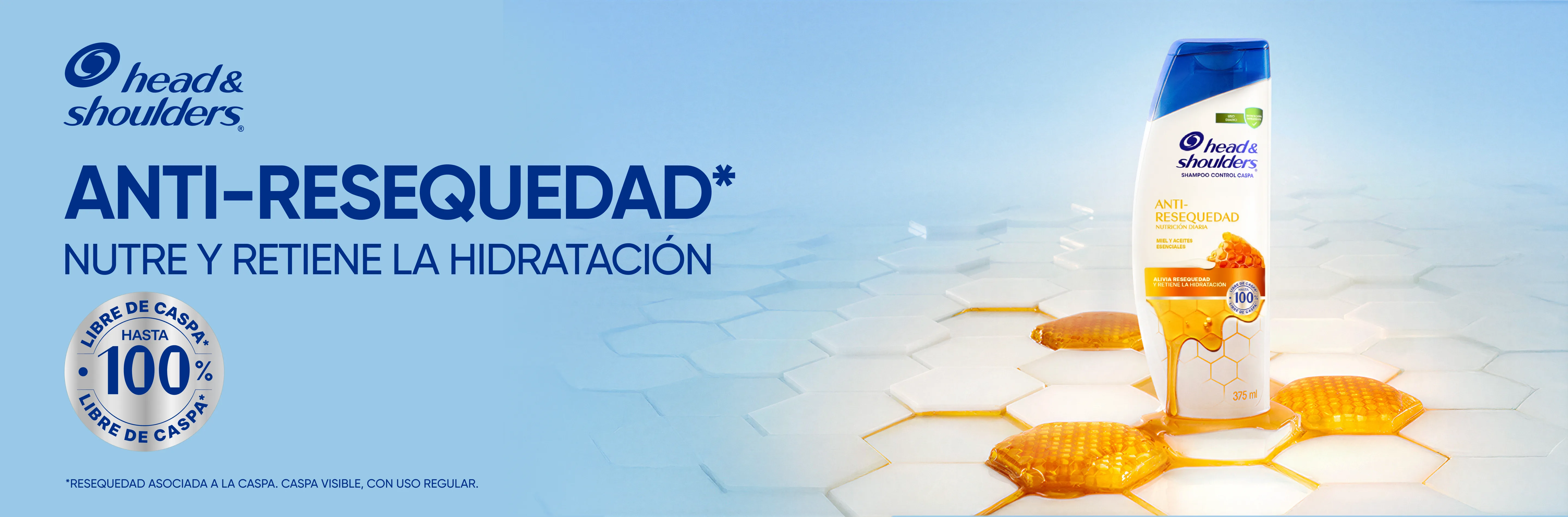 Botella de Head & Shoulders Shampoo Anti-Resequedad con panales de miel y gotas doradas sobre fondo azul claro, con texto "Anti-Resequedad: Nutre y retiene la hidratación. Libre de caspa hasta 100%"