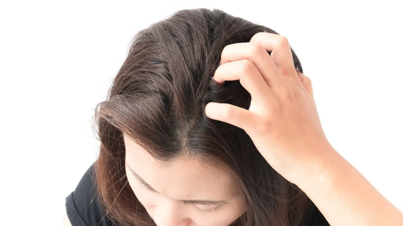 Woman with itchy scalp