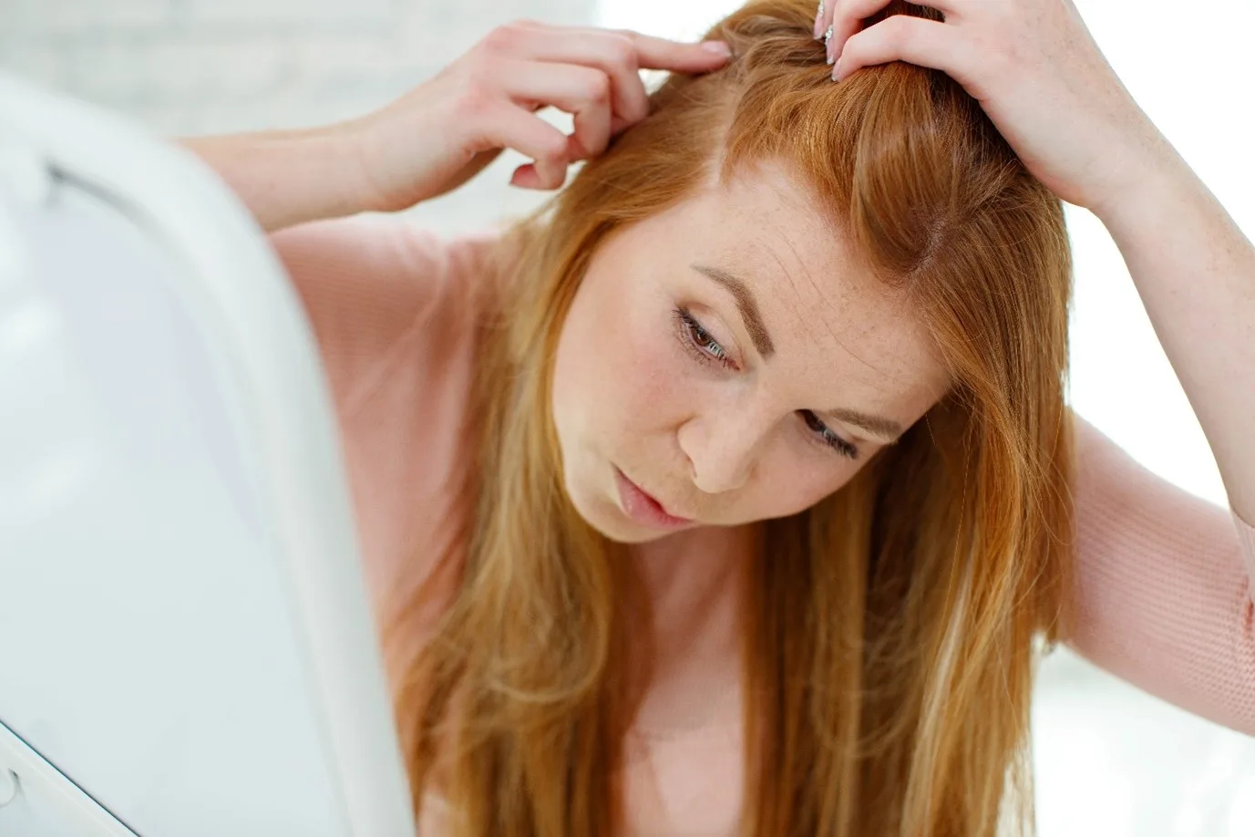woman worried about her scalp build-up