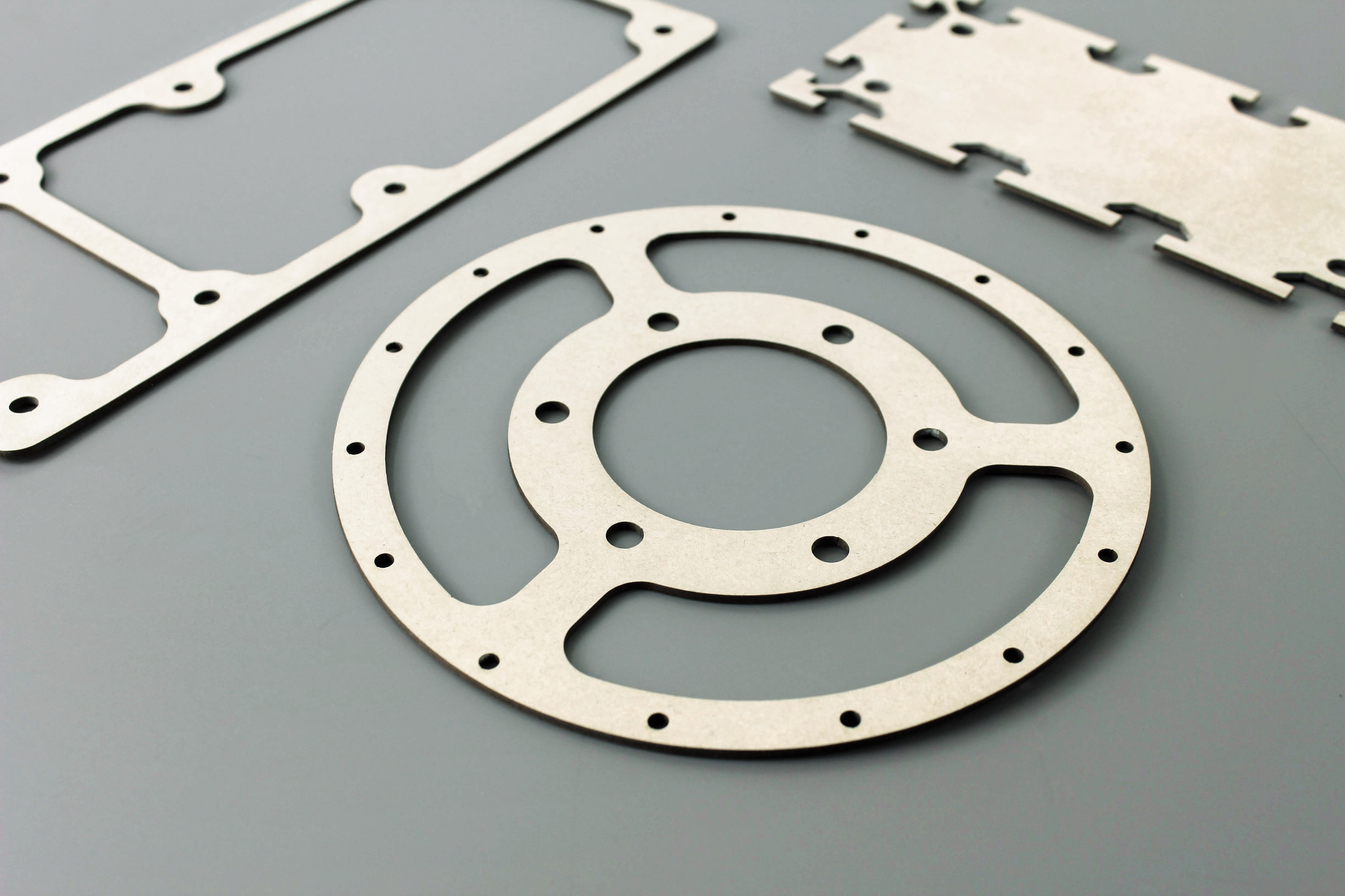 Various gaskets with complex shapes, laser cut from gasket paper