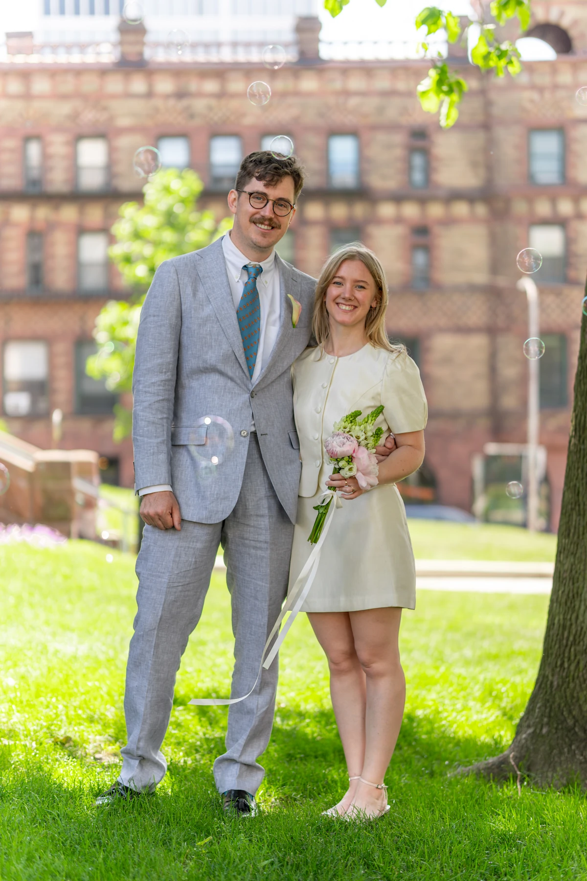 Bride and groom formal portrait with bubbles at Cambridge City Hall, Massachusetts.