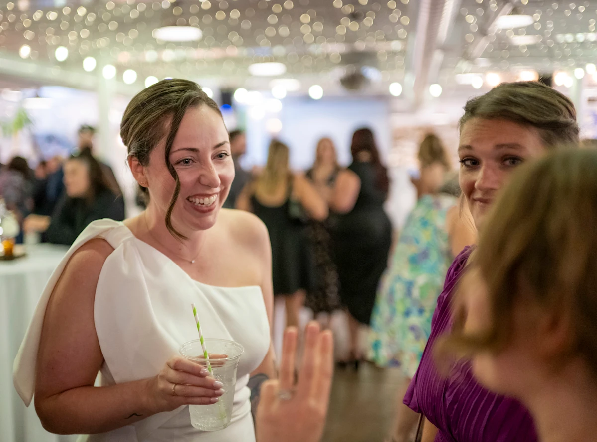 Bride laughing with friends at the White Room