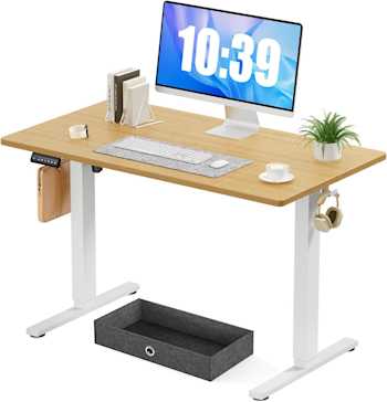 an image of an adjustable height standing desk with a monitor and keyboard on top