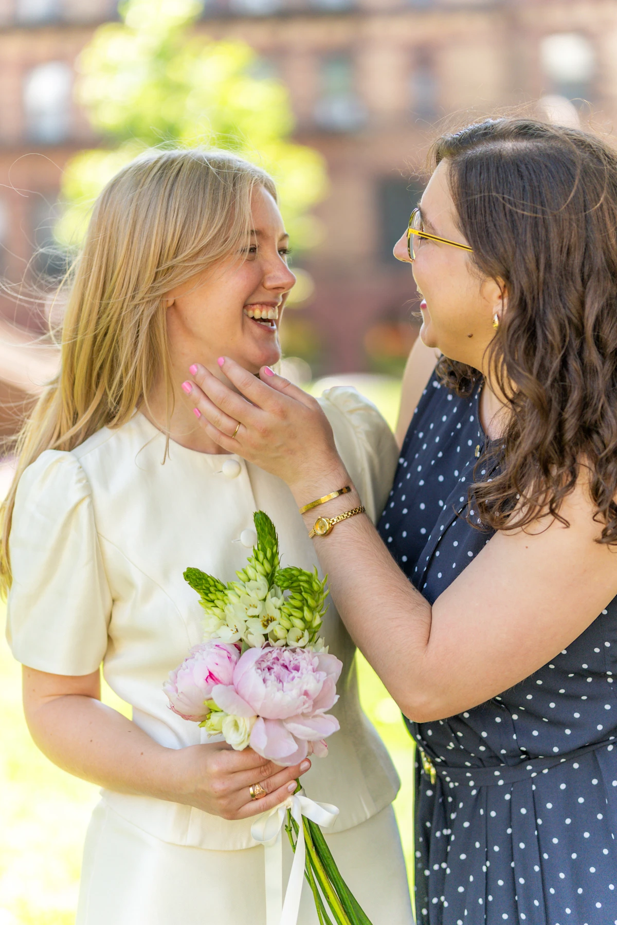 Friend laughing with bride
