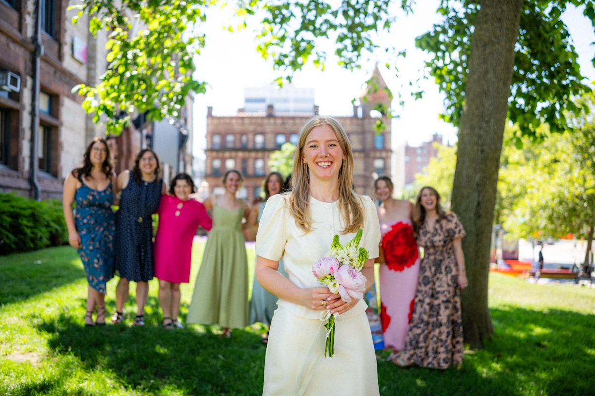 Bride standing in front of bridal party