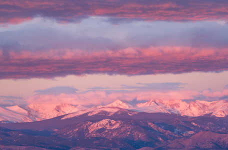 A landscape image of St. Vrain Peaks at sunrise
