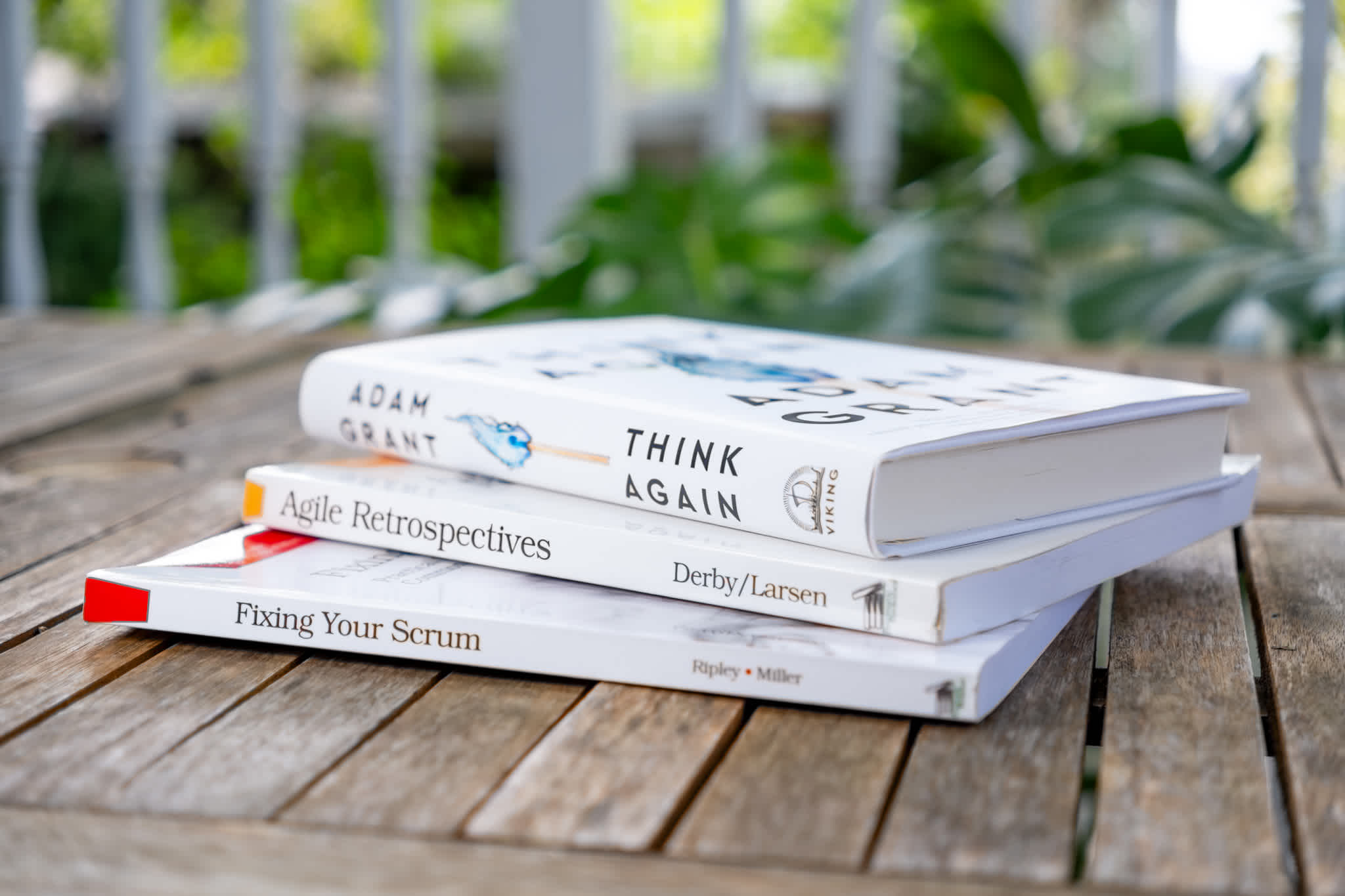 Agile books stacked on an outdoor table