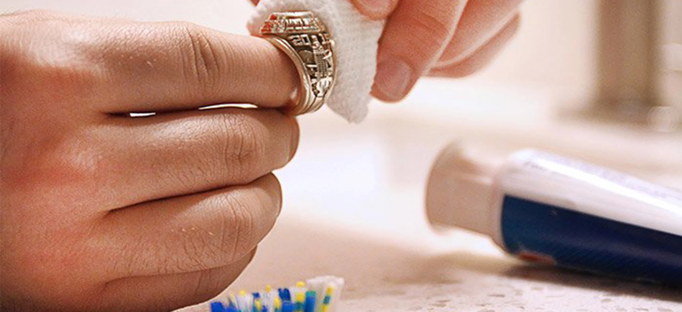 Man cleaning ring with Bounty paper towel