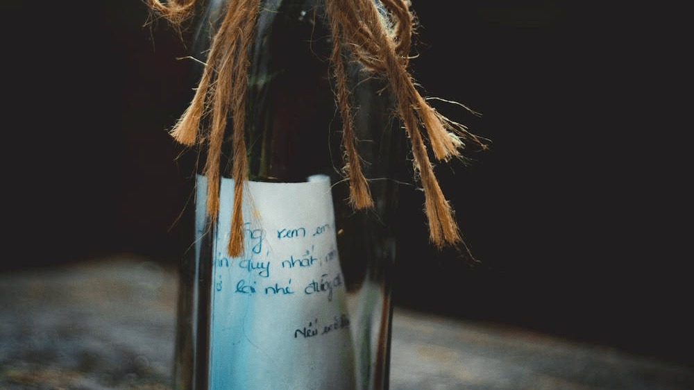 Message in a bottle with flowers