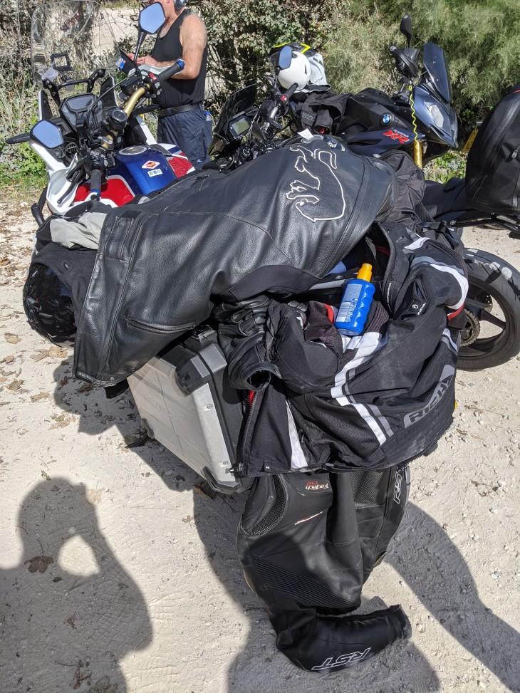 4 sets of gear padlocked to an Africa Twin